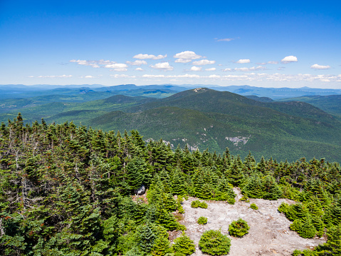 A view from the summit of a mountain in the Mahoosuc Range in Maine, alone the Appalachian Trail.