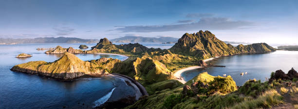 Panoramic warm view at top of 'Padar Island' in sunrise (late morning) from Komodo Island, Komodo National Park, Labuan Bajo, Flores, Indonesia. in summer Panoramic warm view at top of 'Padar Island' in sunrise (late morning) from Komodo Island, Komodo National Park, Labuan Bajo, Flores, Indonesia. in summer pulau komodo stock pictures, royalty-free photos & images