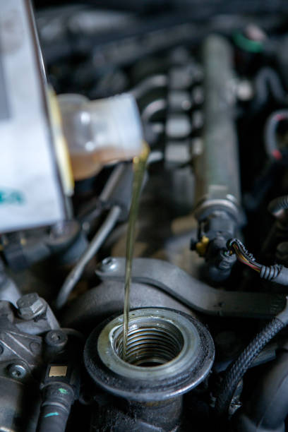 istock pouring new fresh motor oil in car engine 1009056744