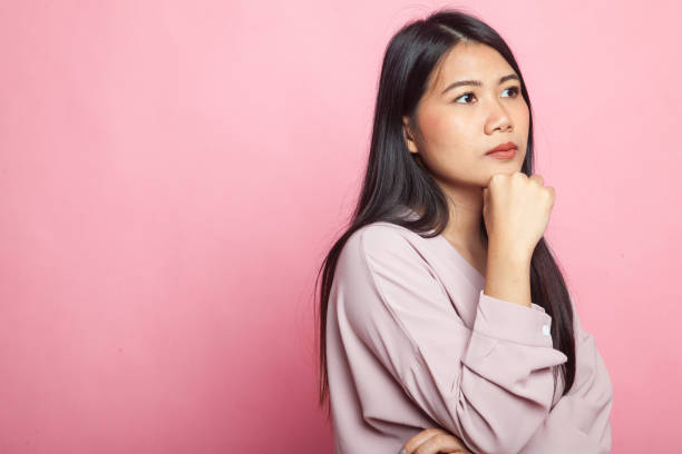 istock Serious  young Asian woman  look away. 1009059852