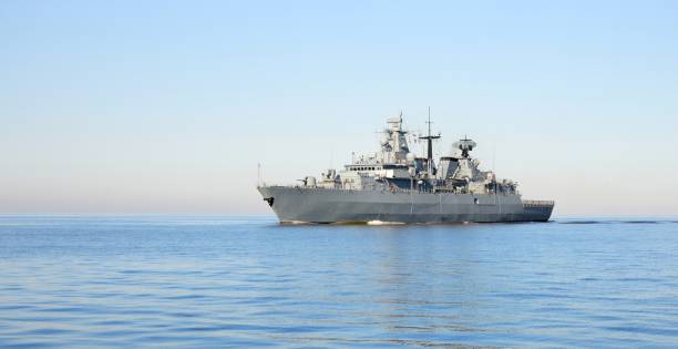 istock Large military ship in the open sea on a clear day 1009063654