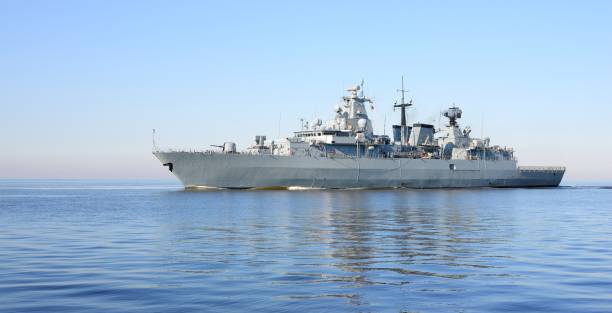 istock Large military ship in the open sea on a clear day 1009063656