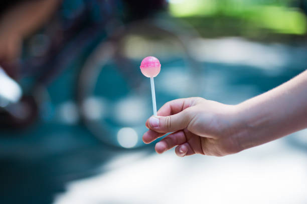 The child holding lollipop in hand. Cracov in Poland.