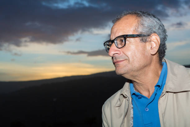 istock Man Close-up Portrait Outdoors During Twilight 1009073486