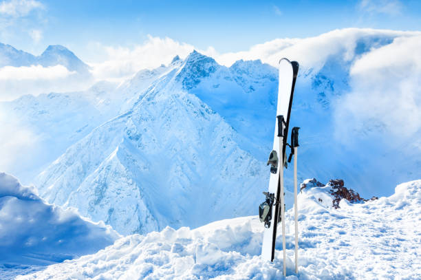 istock Winter mountains and ski equipment in the snow 1009081200