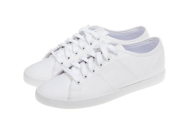 istock Pair of new white sneakers, isolated on white background 1009081408