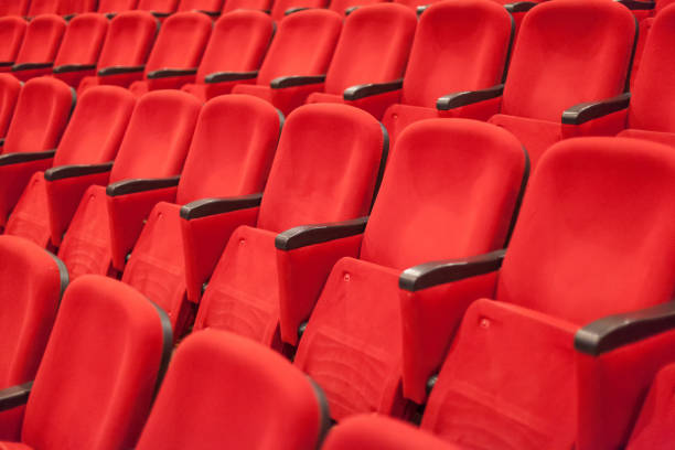 istock empty red cinema or theater seats 1009082962