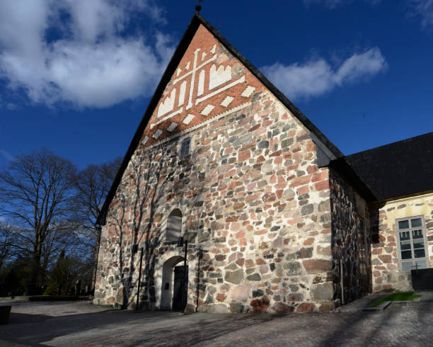 istock typical old Finnish Lutheran stone church and cemetery 1009100980