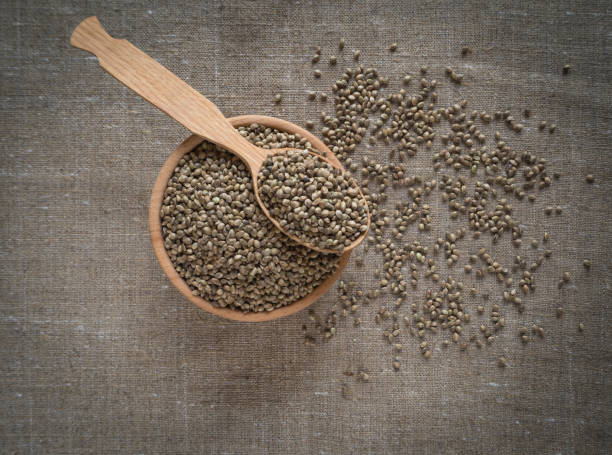 istock Ecological hemp seeds in a wooden bowl. 1009122078