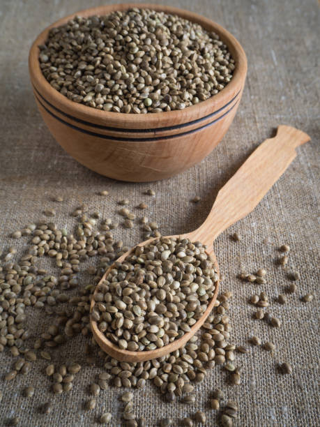 istock Ecological hemp seeds in a wooden bowl. 1009122136