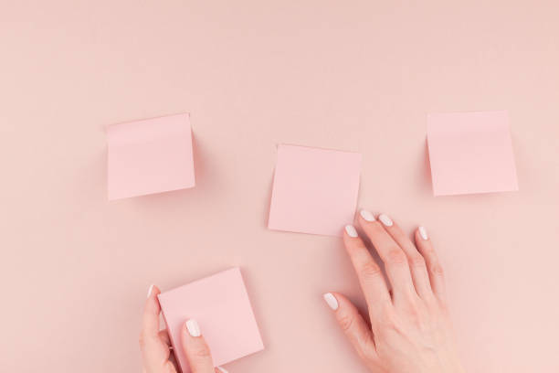 istock Woman hands with paper stickers 1009130072