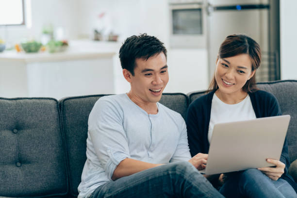 istock Young couple surfing the net 1009130102