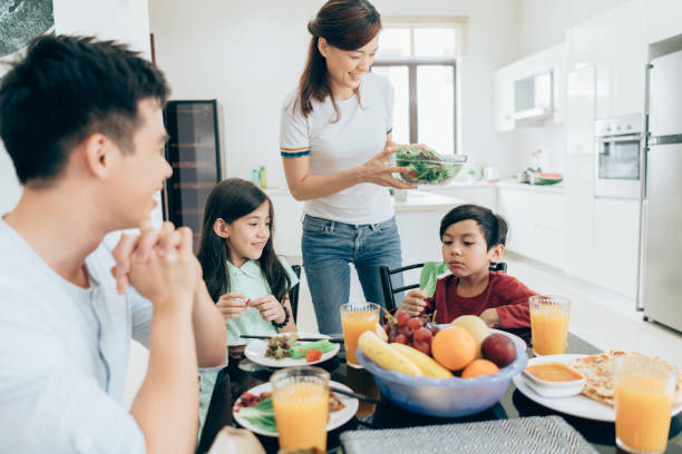 istock Modern mom serving a healthy meal 1009130126