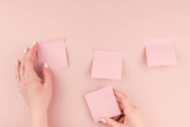istock Woman hands with paper stickers 1009130156
