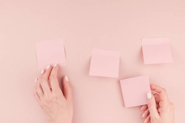 istock Woman hands with paper stickers 1009130188