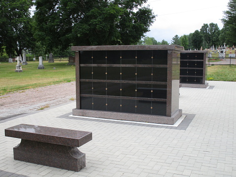 columbaria with bench in cemetery