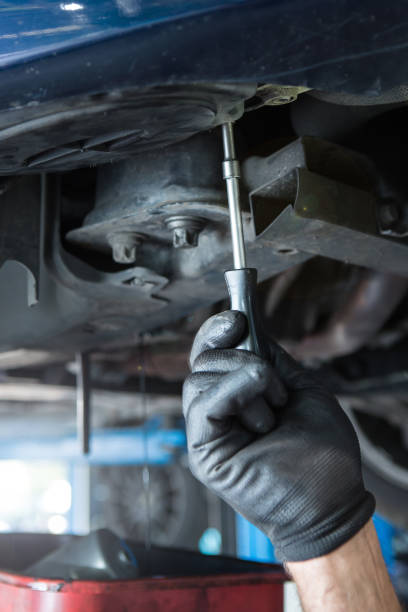 istock Mechanic holding screwdriver , auto repairing or servicing concept 1009137438