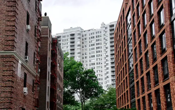 A trio of high rise residential apartment buildings are seen in this cityscape, an example of urban density in The Bronx, New York City, Northeastern USA.