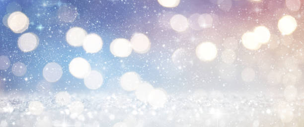 istock Christmas light background.  Holiday glowing backdrop. Defocused Background With Blinking Stars. Blurred Bokeh. 1009147436