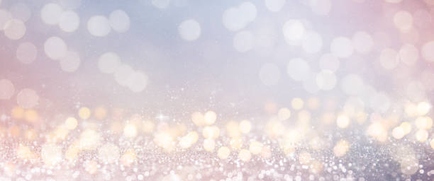 istock Christmas light background.  Holiday glowing backdrop. Defocused Background With Blinking Stars. Blurred Bokeh. 1009152414