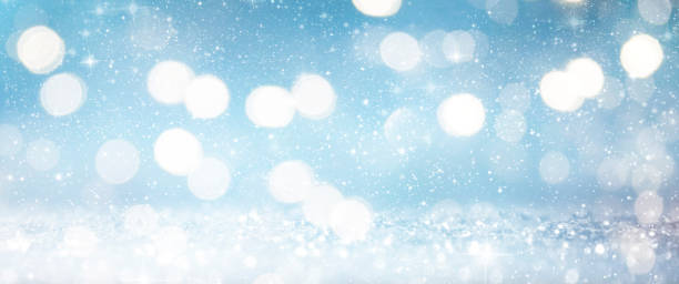 istock Christmas light background.  Holiday glowing backdrop. Defocused Background With Blinking Stars. Blurred Bokeh. 1009152700