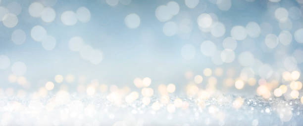 istock Christmas light background.  Holiday glowing backdrop. Defocused Background With Blinking Stars. Blurred Bokeh. 1009154930