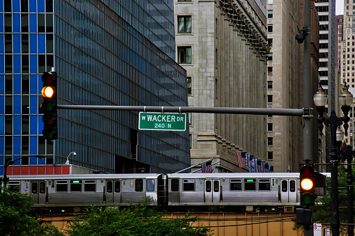 High angle view of Chicago's elevated green line train and track on Lake and LaSalle Streets in Chicago Loop during rush hour.