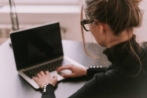 istock Young girl working with laptop 1009159894