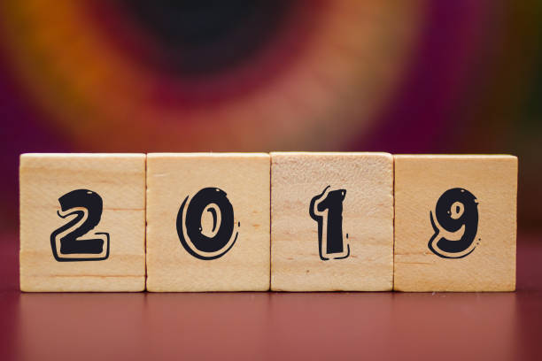 istock 2019 on Wood cubes against colorful background 1009179164