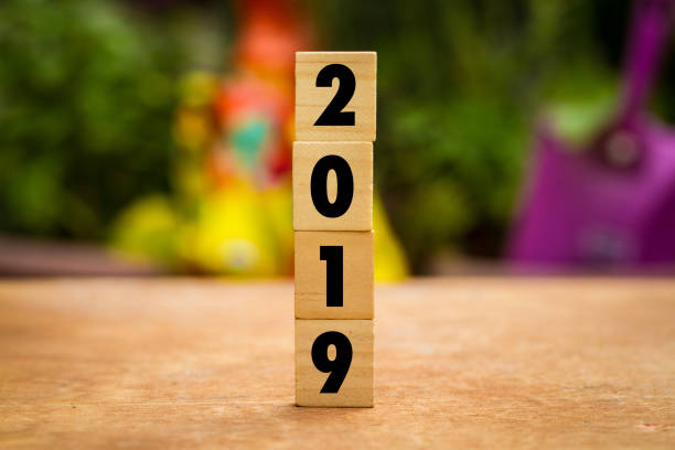 istock 2019 on wooden cubes on table over blur bokeh background 1009186304