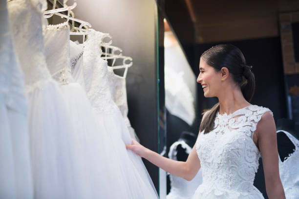 istock Young bride feeling happy in a bridal store 1009194814
