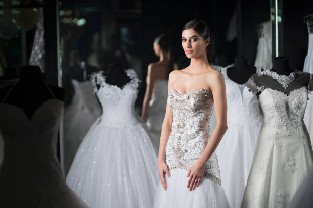 istock Fashion model wearing wedding dress 1009194886