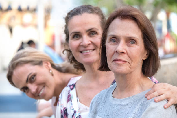 Senior caucasian woman posing with her mature daughters