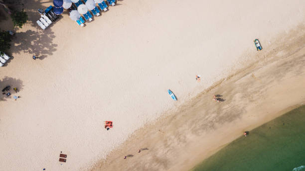 istock sand beach coast with nice color ocean wave with people sun bathdrone view image pataya thailand 1009216148