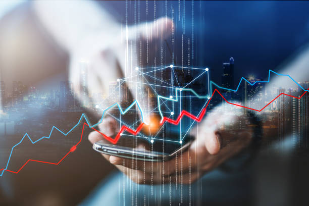 istock business financial technology with hand use smartphone  blank screen close up finger press stock chart above the screen 1009216188