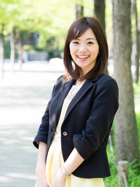 istock attractive asian woman in park 1009216656