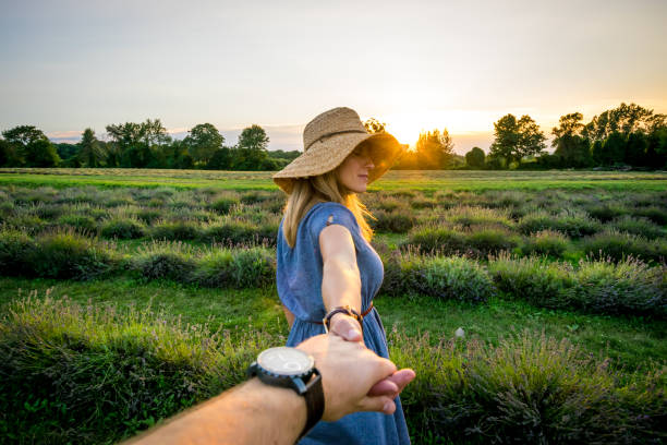 istock Young couple in lavender field at sunset 1009226670