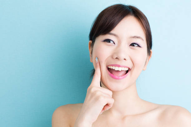 istock attractive asian woman beauty image on blue background 1009229108