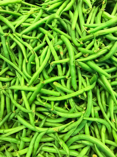 istock nice closeup detailed view of bright green appetizing fresh beans, background 1009231520