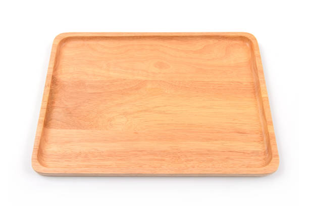 istock Brown wooden cutting board on white background 1009244182