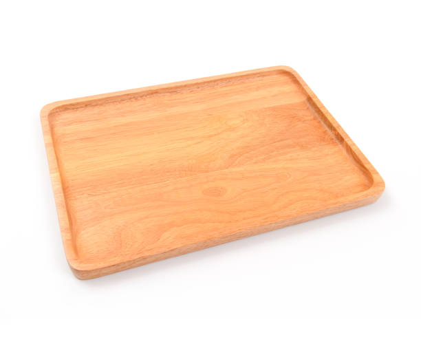 istock Brown wooden cutting board on white background 1009244210