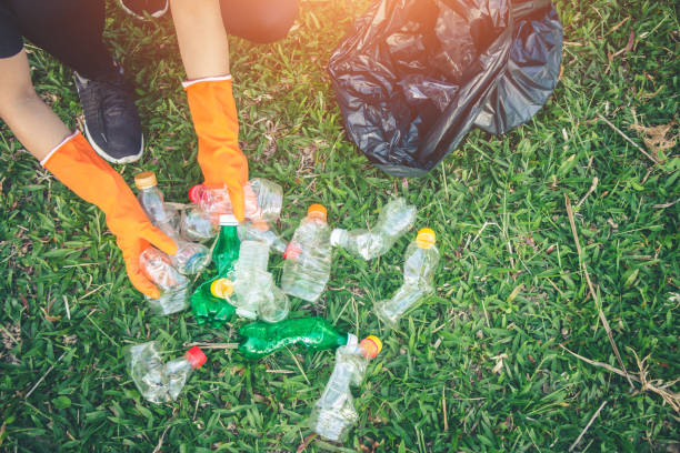 istock Women volunteer help garbage collection charity environment. 1009266788