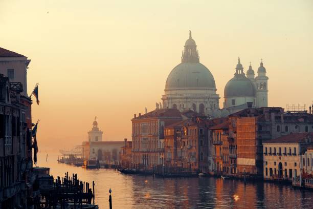 istock Venice Grand Canal sunrise and boat 1009281782