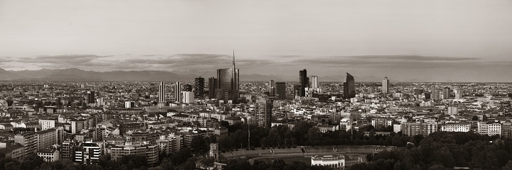 Milan city skyline panorama viewed from above at sunset in Italy.