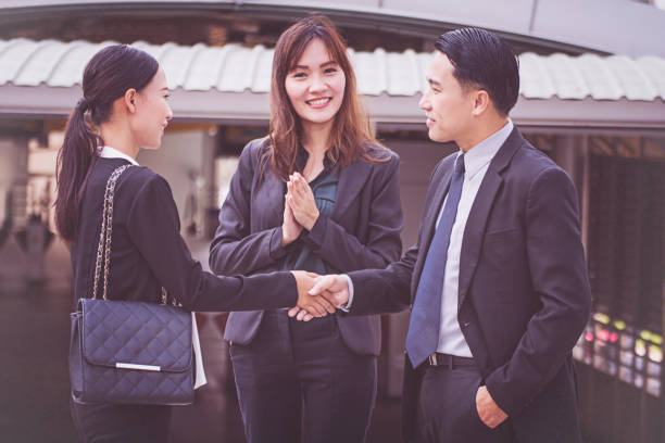 istock Business team working at city, looking a mobile phone 1009339550