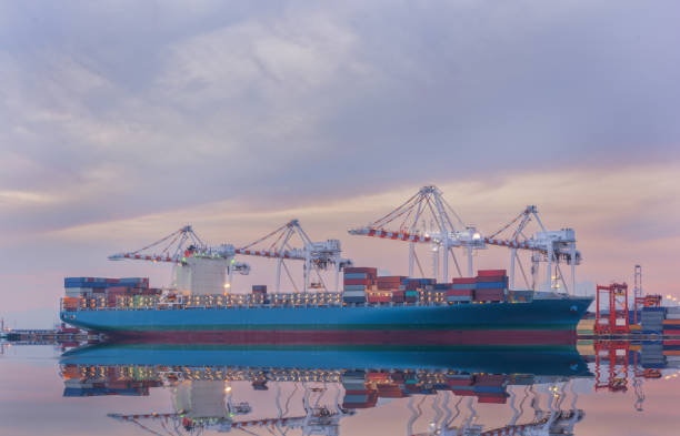 istock Cargo ship in Trade Port , Container loading Shipping by crane 1009342592