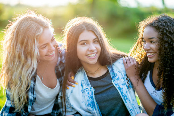 istock Girls Hanging Out In A Park 1009345288