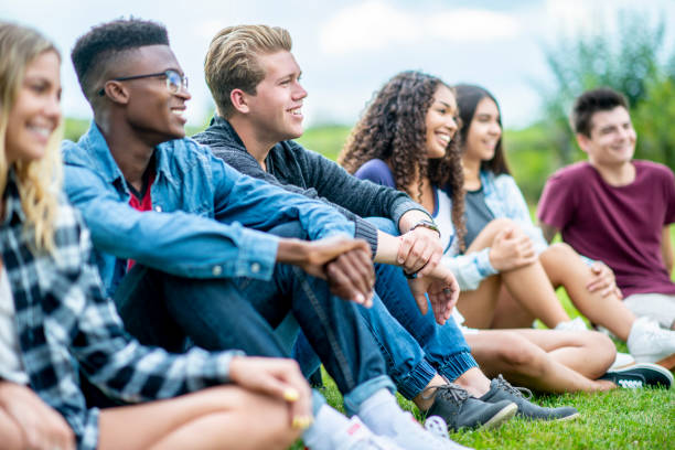 istock Teens Hanging Out In A Park 1009345380