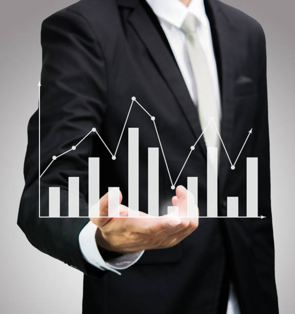 istock Businessman standing posture hand holding graph finance 1009345872
