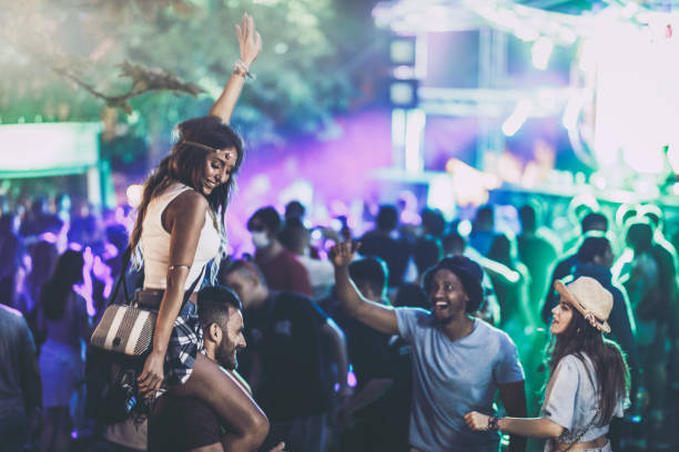 istock Happy friends having fun while dancing on a music festival. 1009350636